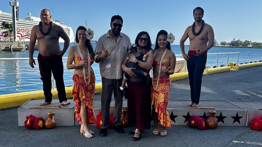 Gautam, Kanak, and Gia with Hawaiian dancers at the cruise dock