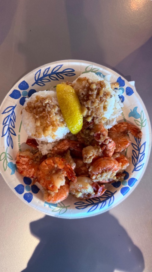 Giovanni's shrimp scampi on a paper plate with rice and lemon, North Shore Oahu