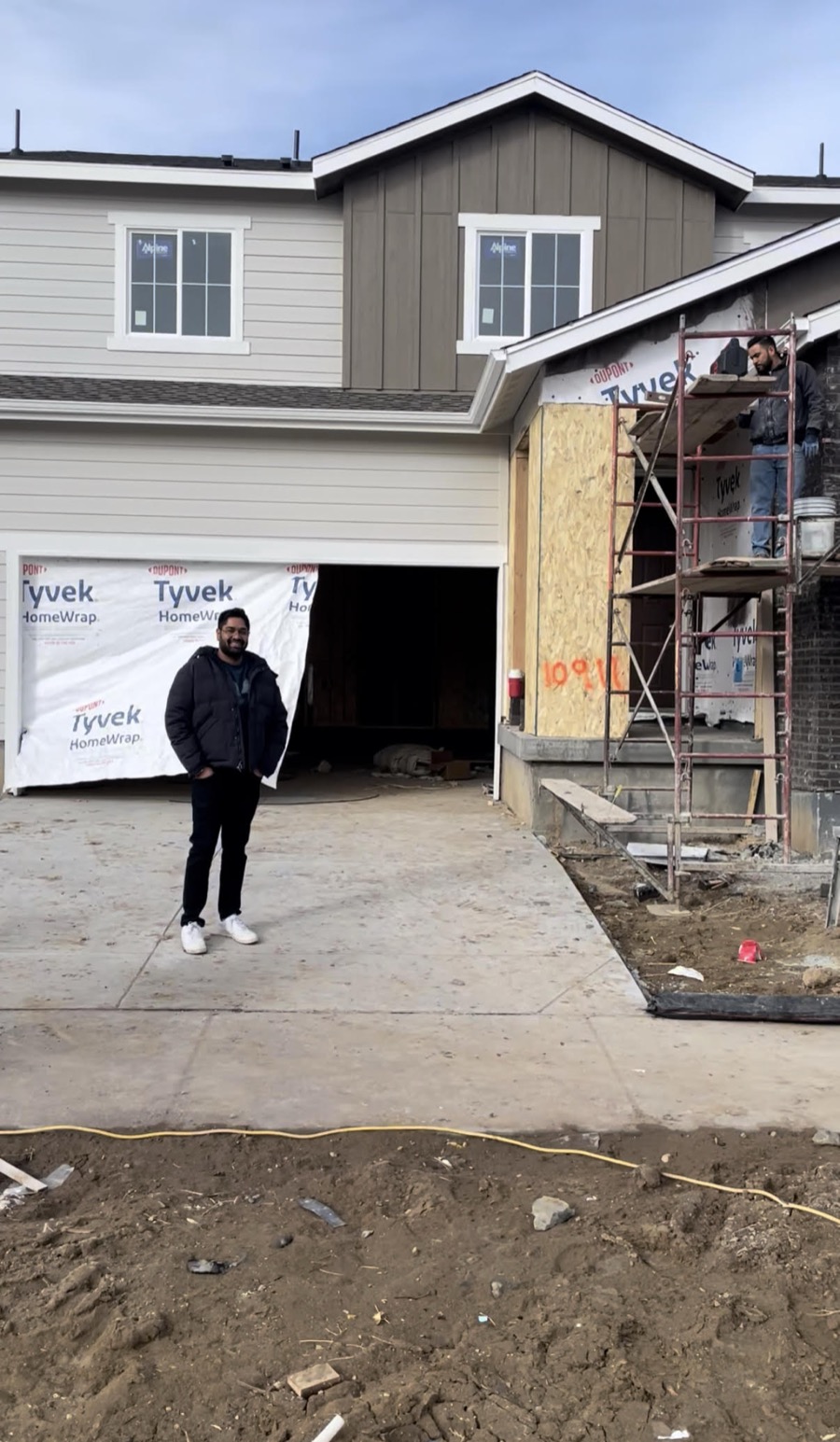 Standing outside the house while it was being built, Parker